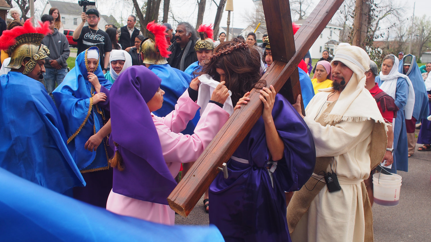 Veronica, played by St. Vincent de Paul parishioner Alyssa Luna wipes Jesus’ face during an outdoor reenactment of the Stations of the Cross on Good Friday outside St. Patrick Chapel in Sedalia. Jesus was portrayed by Mario Rojas.